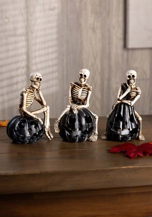 Set of 3 Resin Skeletons Sitting on LED Jack O Lanterns